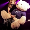 Kylie Minogue playing with teddy bear