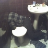 Headless guy in bathroom