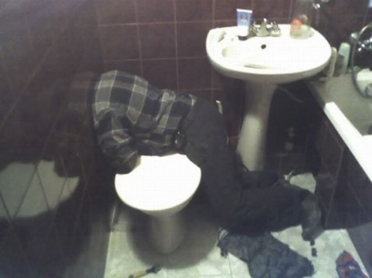 Headless guy in bathroom